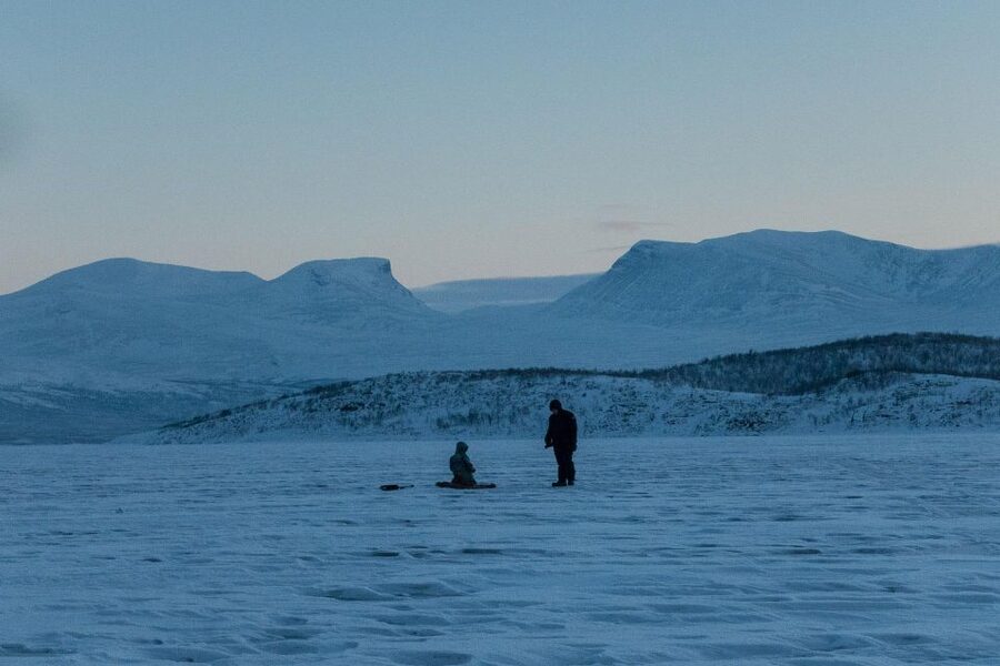 Abisko: Lake Torneträsk Arctic Ice Fishing Trip - The fire, hut, and hot fika break