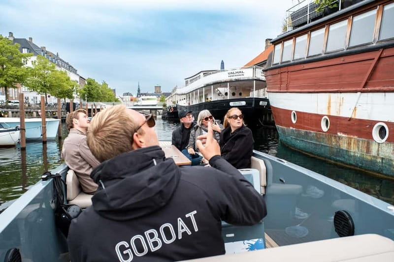 Copenhagen: 1 or 2-Hour Canal Tour in Silent Electric Boats - Inside the covered boat with blankets and heating pads