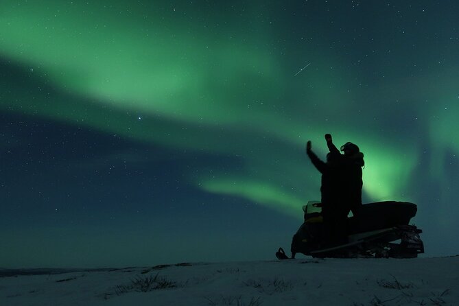 Enjoy the Aurora show on top of the mountain inc tipi dinner - Riding an easy snowmobile toward Mt. Ednavaara