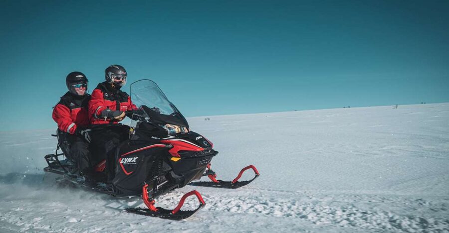 From Alta: Daytime Snowmobile Adventure - Following the old postal road