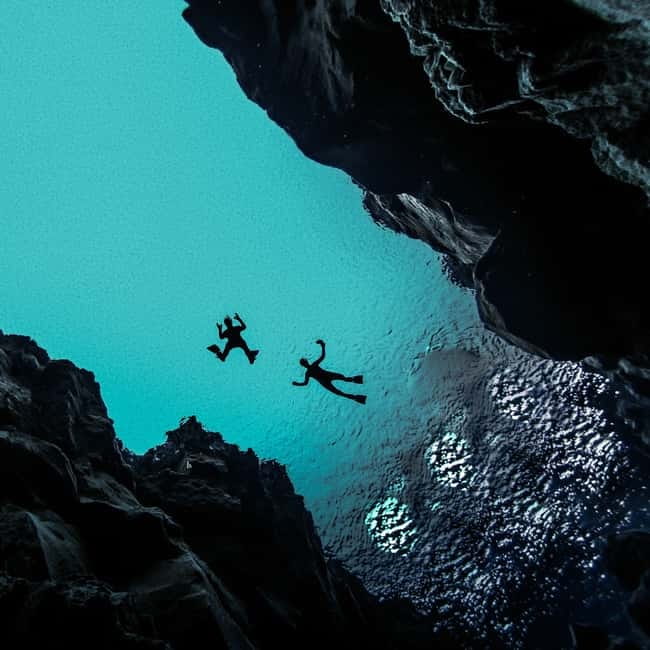 From Reykjavik: Silfra Snorkeling with Free Photos - Entering the fissure and following the blue water