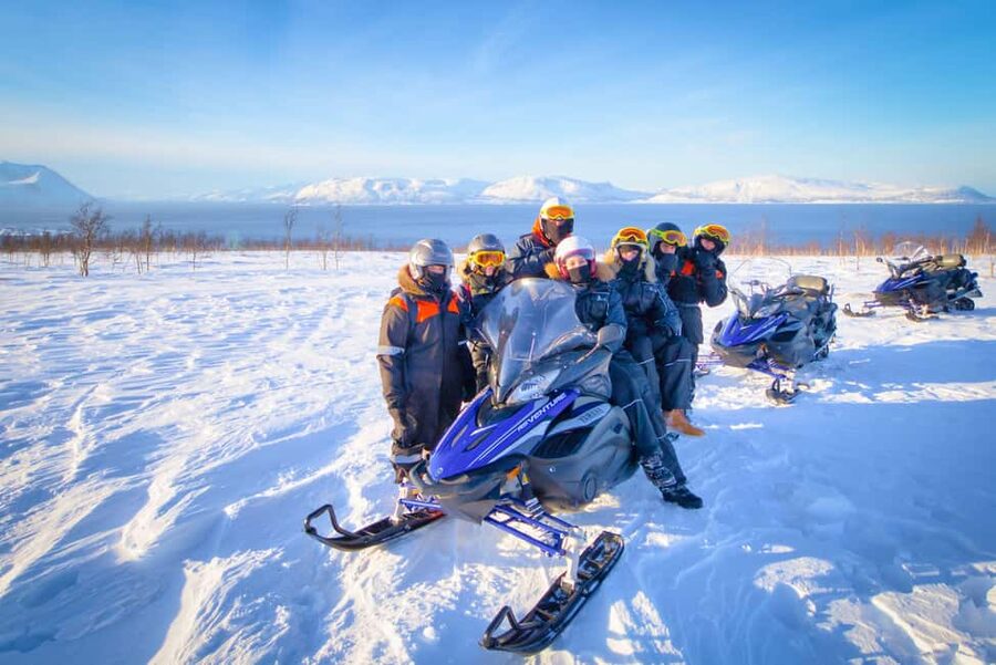 From Tromsø: Lyngen Alps Guided Snowmobile Tour - Fjords, forests, and photo stops