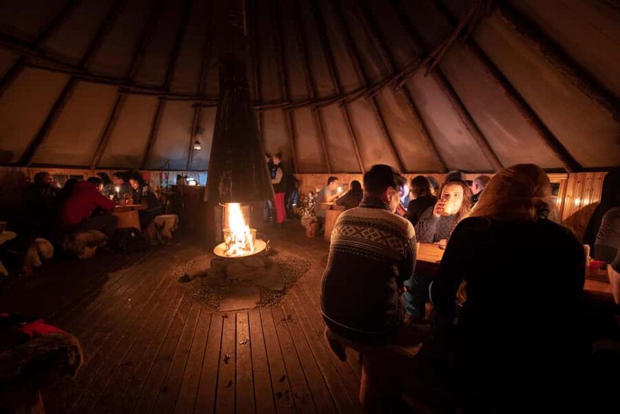 From Tromsø: Northern Lights Visit at Camp Tamok - The Sámi lávvu and a hot meal by the fire