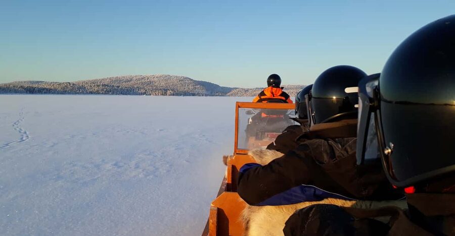 Ivalo: Ice Fishing Tour to Lake Inari, Reindeers & Lunch - A snowmobile sleigh ride with a practical advantage