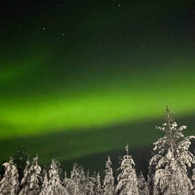 Levi: Northern Lights Hunt Including Campfire Snacks - A Finnish laavu beside a quiet Lapland lake