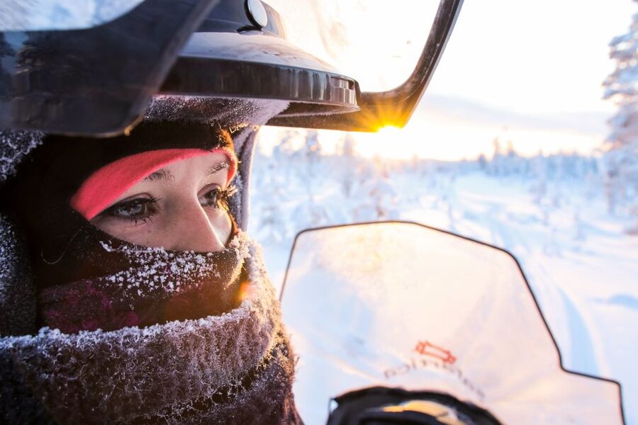 Levi: Snowmobile Safari for Adults - Riding from snowy forest to open lake views