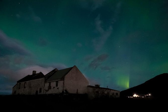Northern Lights Small-Group Tour with Hot Chocolate & Photos - Waiting outdoors with cocoa and Icelandic pastries