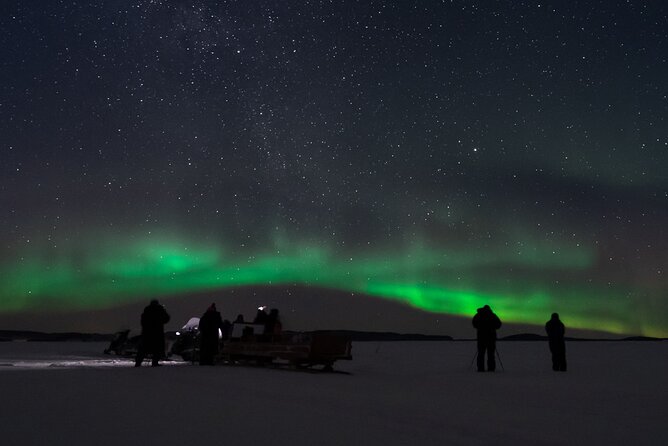 Northern lights tour to Lake Inari from Ivalo, Reindeers & Dinner - The snowmobile-pulled sleigh across the frozen wilderness
