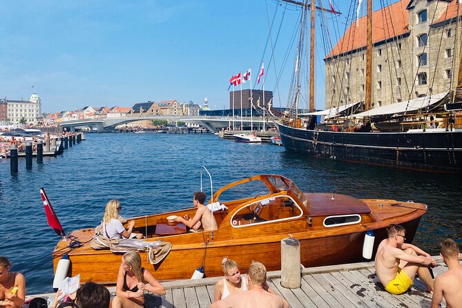 Private Copenhagen Boat cruise in Scandinavian mahogany boat - The royal yacht and Copenhagen’s harbor icons