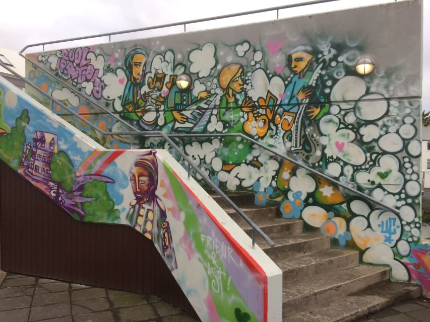 Reykjavik: Guided City Walking Tour - Tjörnin, local snacks, and a short pause