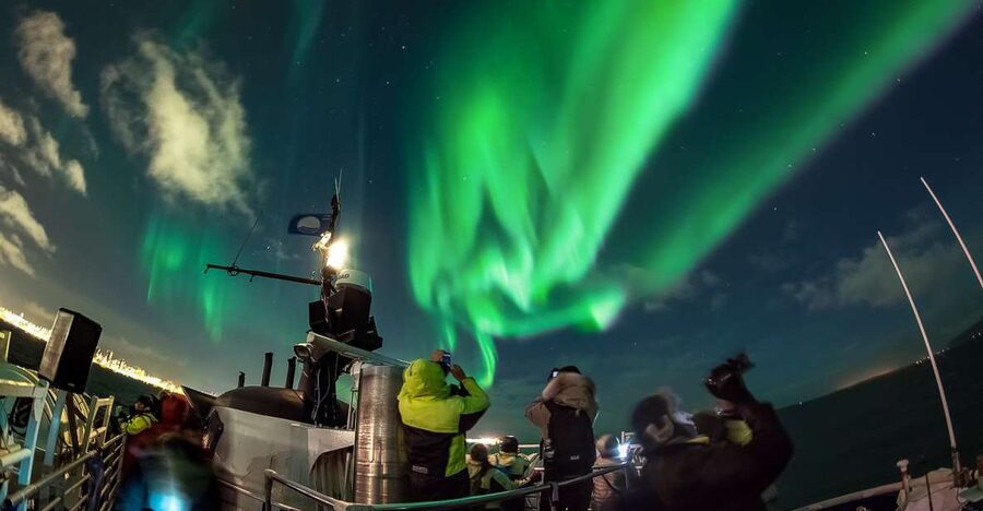 Reykjavik: Northern Lights Guided Boat Tour - Warm overalls, hot drinks, and a place to thaw out