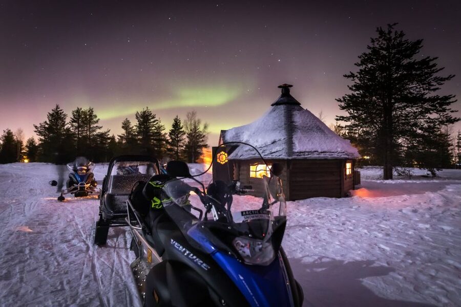 Rovaniemi: Aurora Borealis Snowmobile Safari with Campfire - Warm juice, cookies, and a fire in a kota