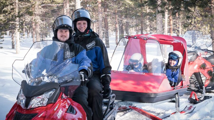 Rovaniemi: Family Snowmobile Safari with Campfire and Snacks - Riding the snowy forest trails