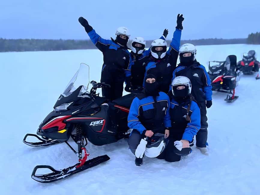 Rovaniemi: Guided Wilderness Snowmobile Safari & Barbeque - Getting suited up before the engines start