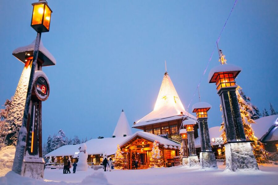 Rovaniemi: Santa’s Village & Snowmobiling to Reindeer Farm - Meeting reindeer at a local farm