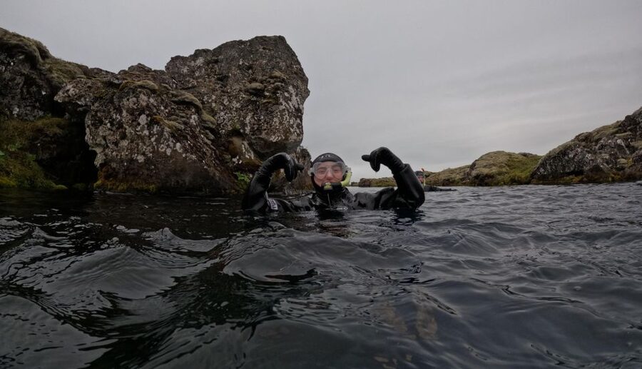 Silfra: Fissure Snorkeling Tour with Underwater Photos - Walking to the water and entering Silfra