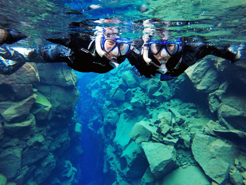 Silfra: Half-Day Snorkeling Day Trip with Underwater Photos - Entering the clear blue water
