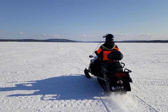 Snowmobile Safari to Lake Inari, meet & feed Reindeers, Lunch - Reindeer at the small island camp