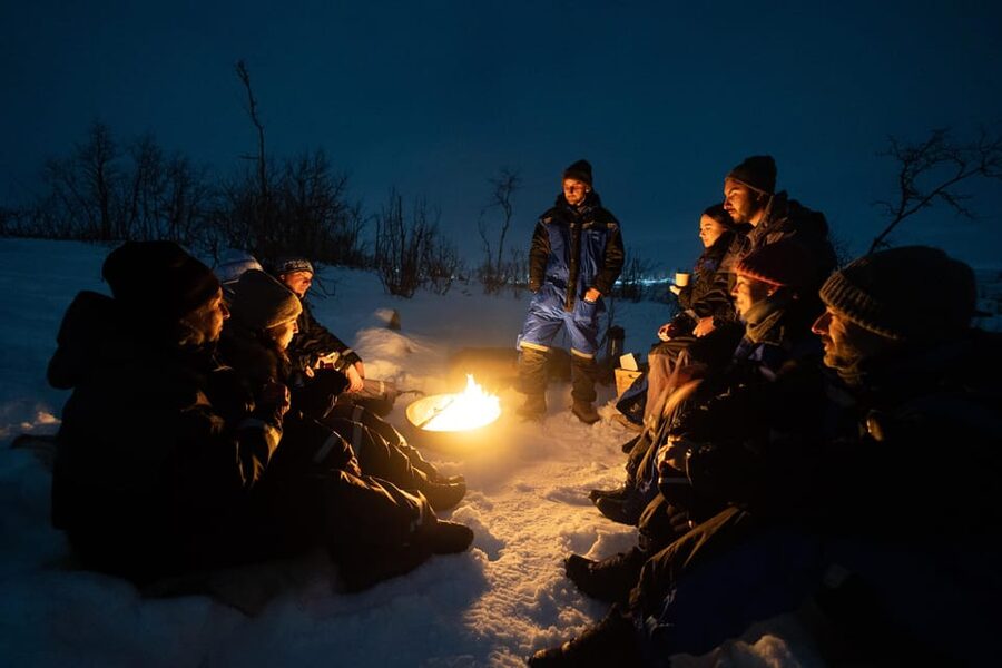 Tromsø: Aurora Borealis, Campfire, Hot Meal, Arctic Tour - Setting up beside the campfire